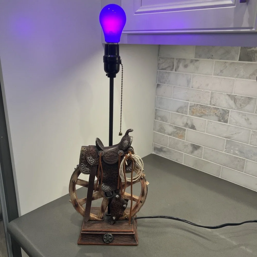 Western vintage Saddle Lamp rope on the saddle, sitting on a wheel/NO LAMP SHADE